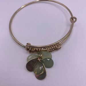 4/$20 Gold tone bangle with floating green beads